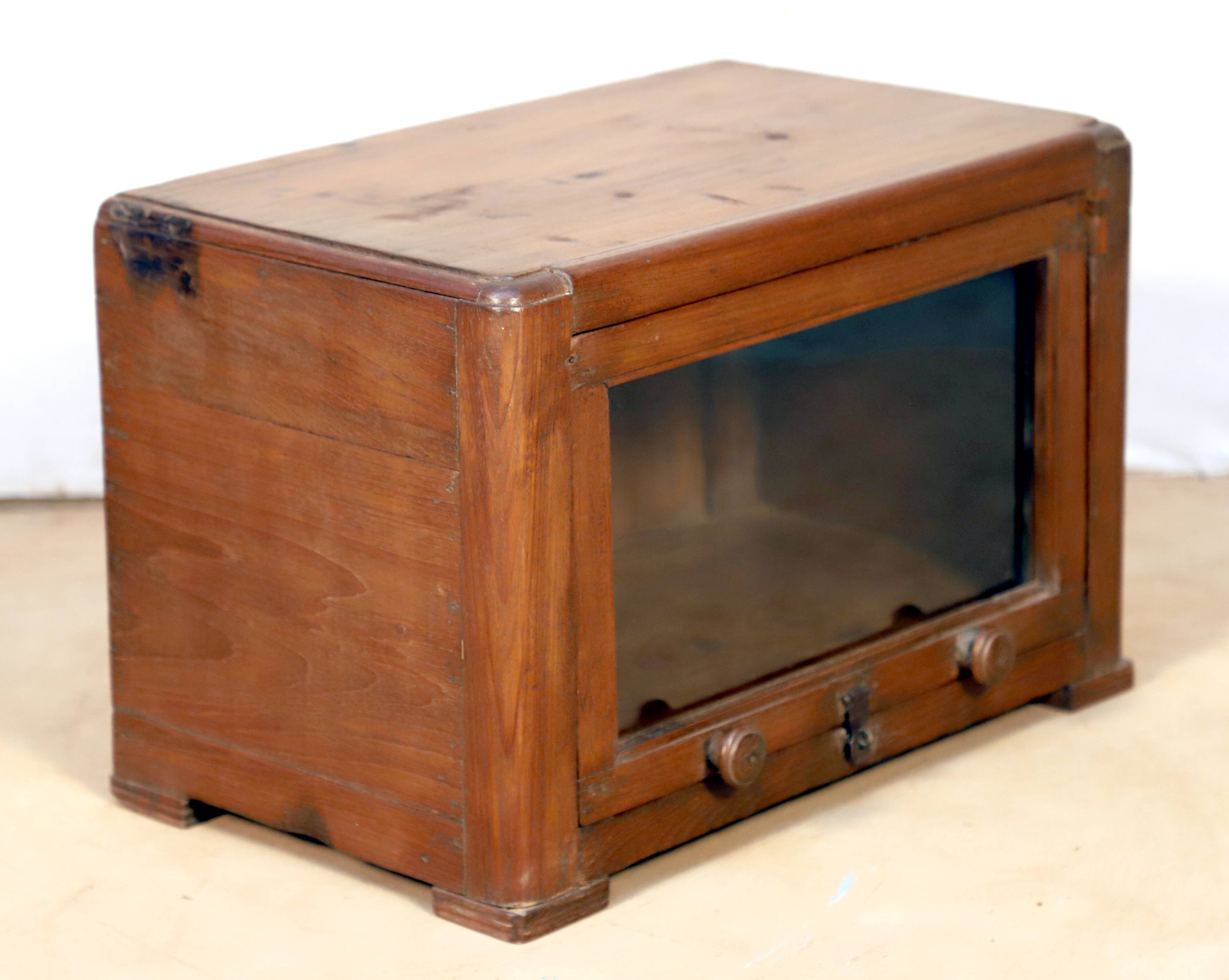 Art Deco showcase in Burmese teak