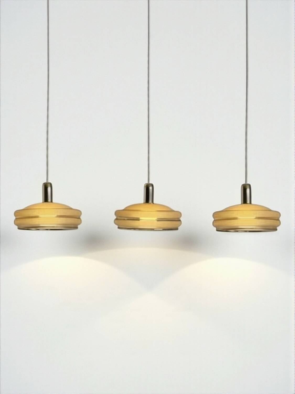 Triple cascade pendant light with vintage frosted glass globes and gold finish