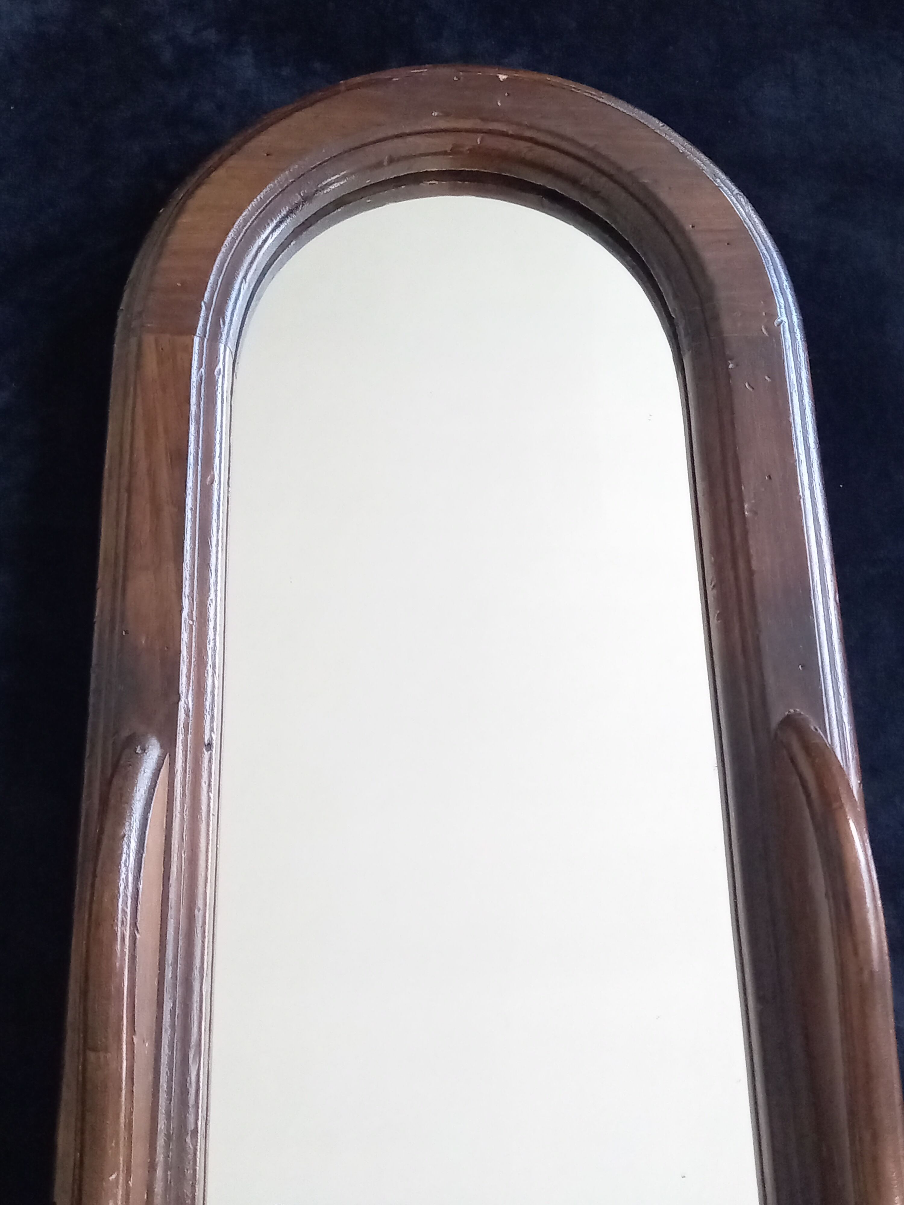 Wall mirror in arched frame with drawer