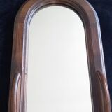Wall mirror in arched frame with drawer