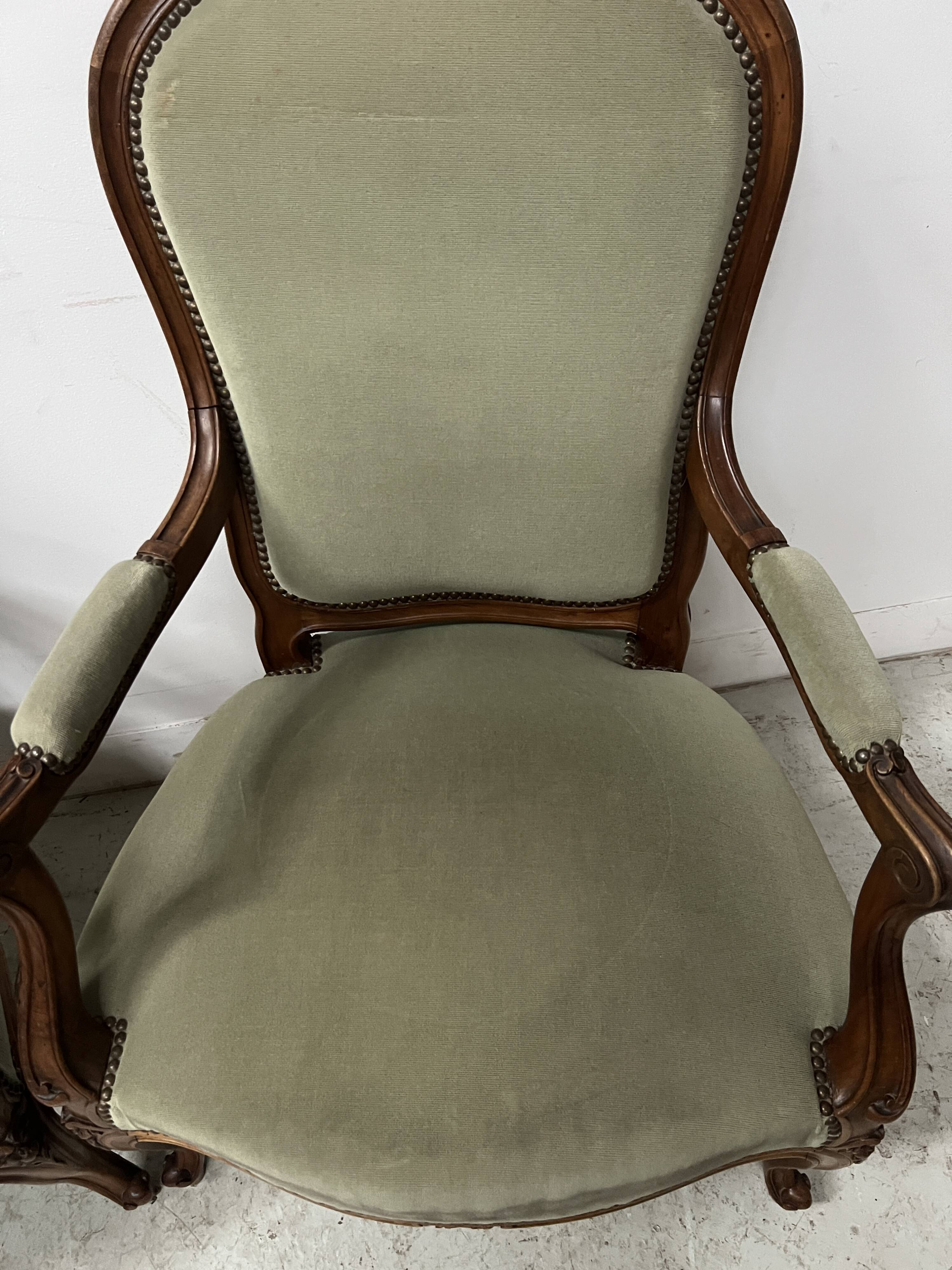 Pair of Louis XV style armchairs in solid walnut, 20th century.