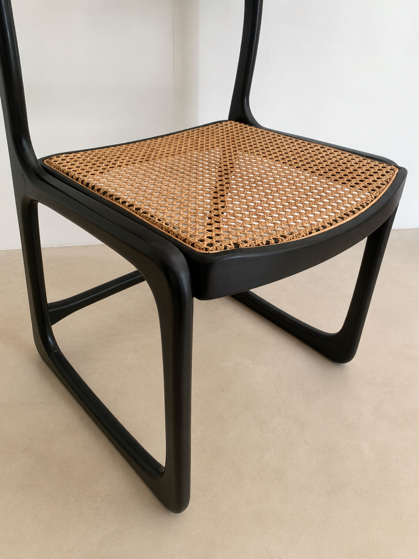 Set of 4 Baumann sled chairs with caning.