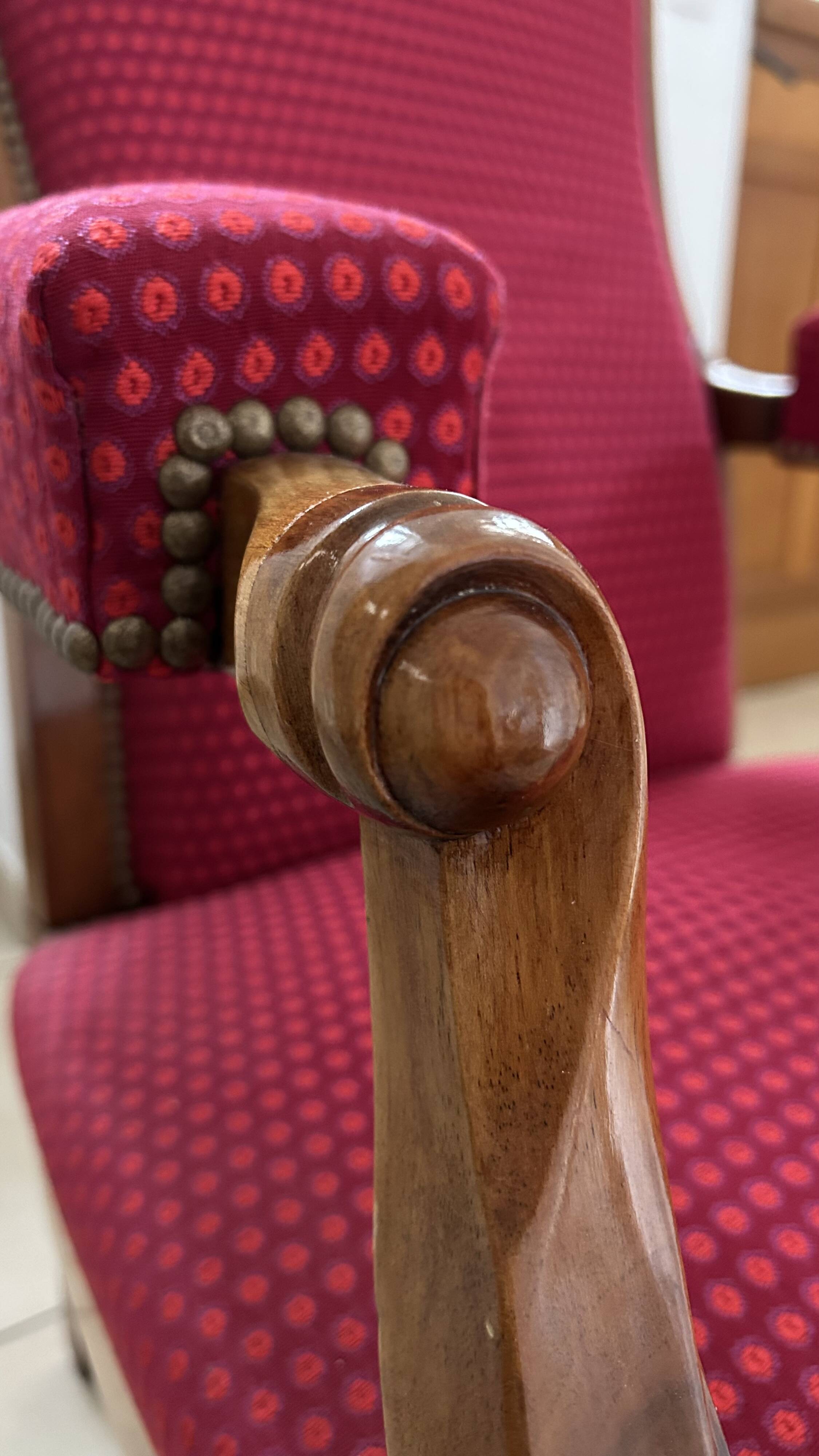 Antique Louis Philippe armchair in walnut and red fabric.