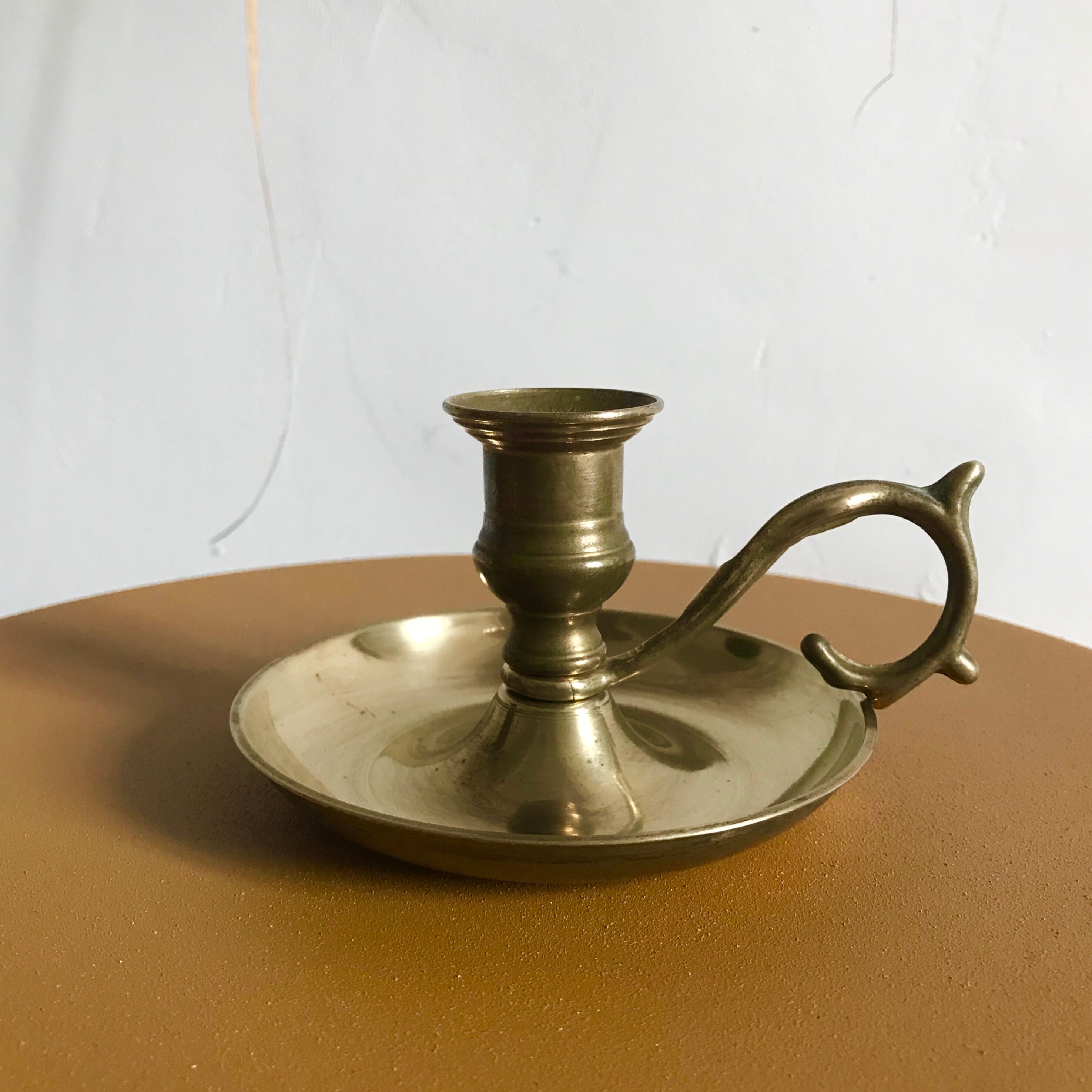 Brass hand-held candlestick