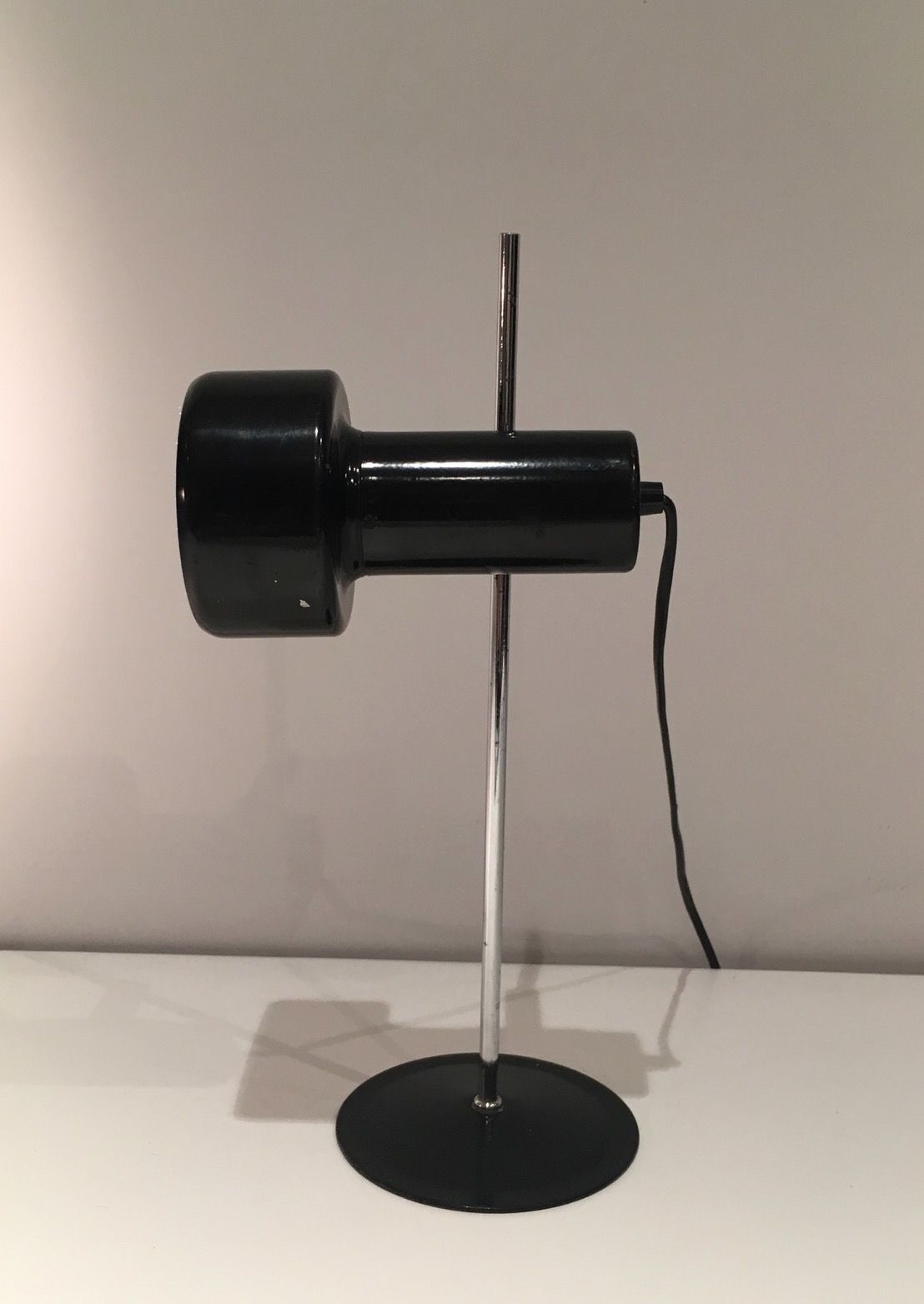 Adjustable lamp in black lacquered metal and chrome. French work. Circa 1970.