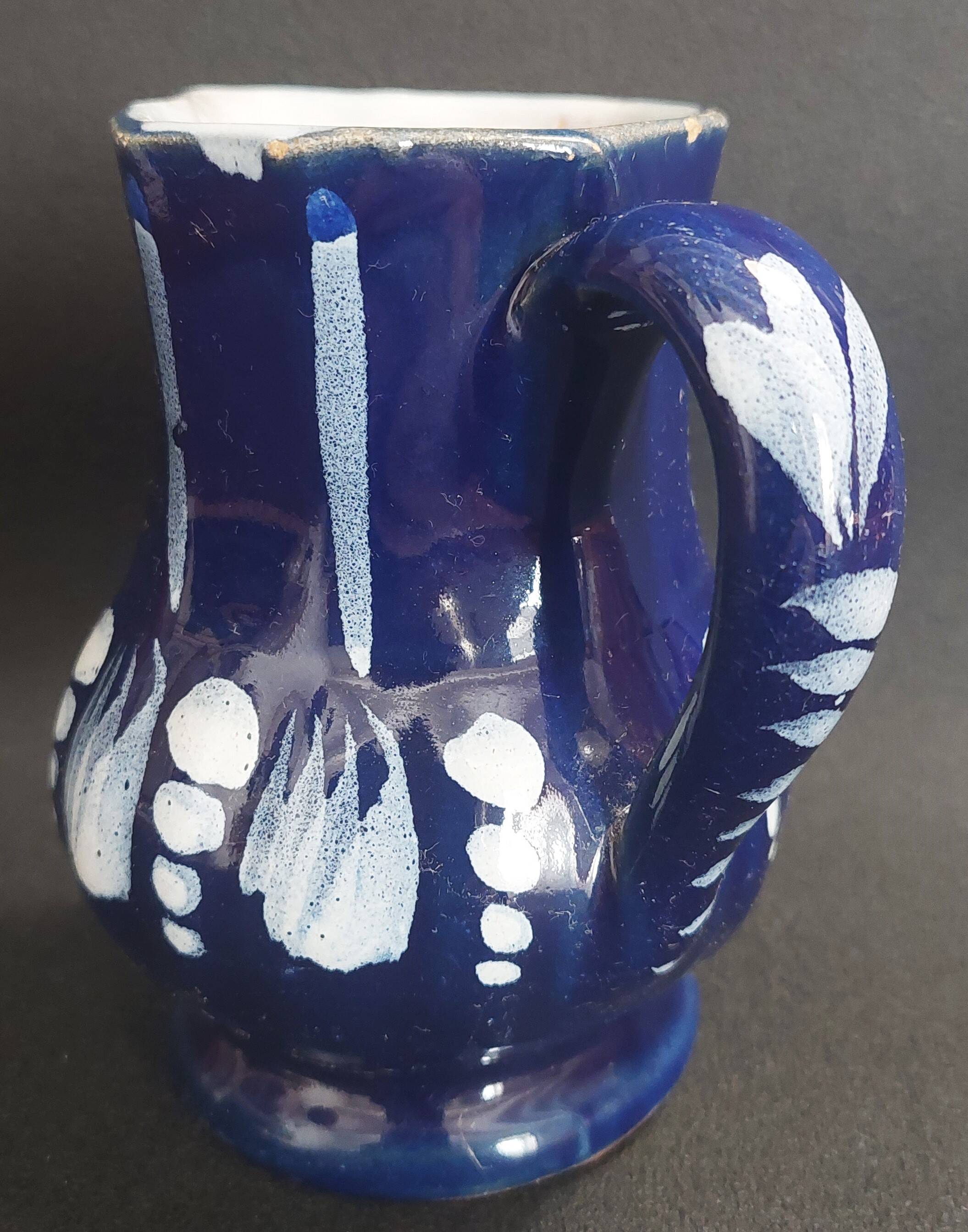 Earthenware pitcher from the North of France with blue covering, 19th century