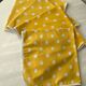 4 yellow napkins with white polka dots