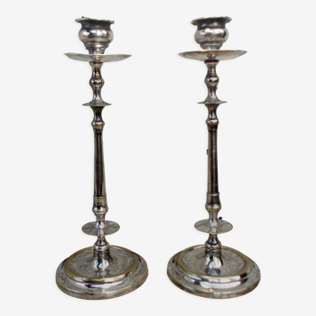 Pair of antique candle holders in silver metal