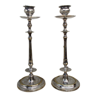 Pair of antique candle holders in silver metal