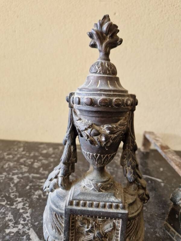 Pair of bronze andirons in Louis XVI style, late 19th century.
