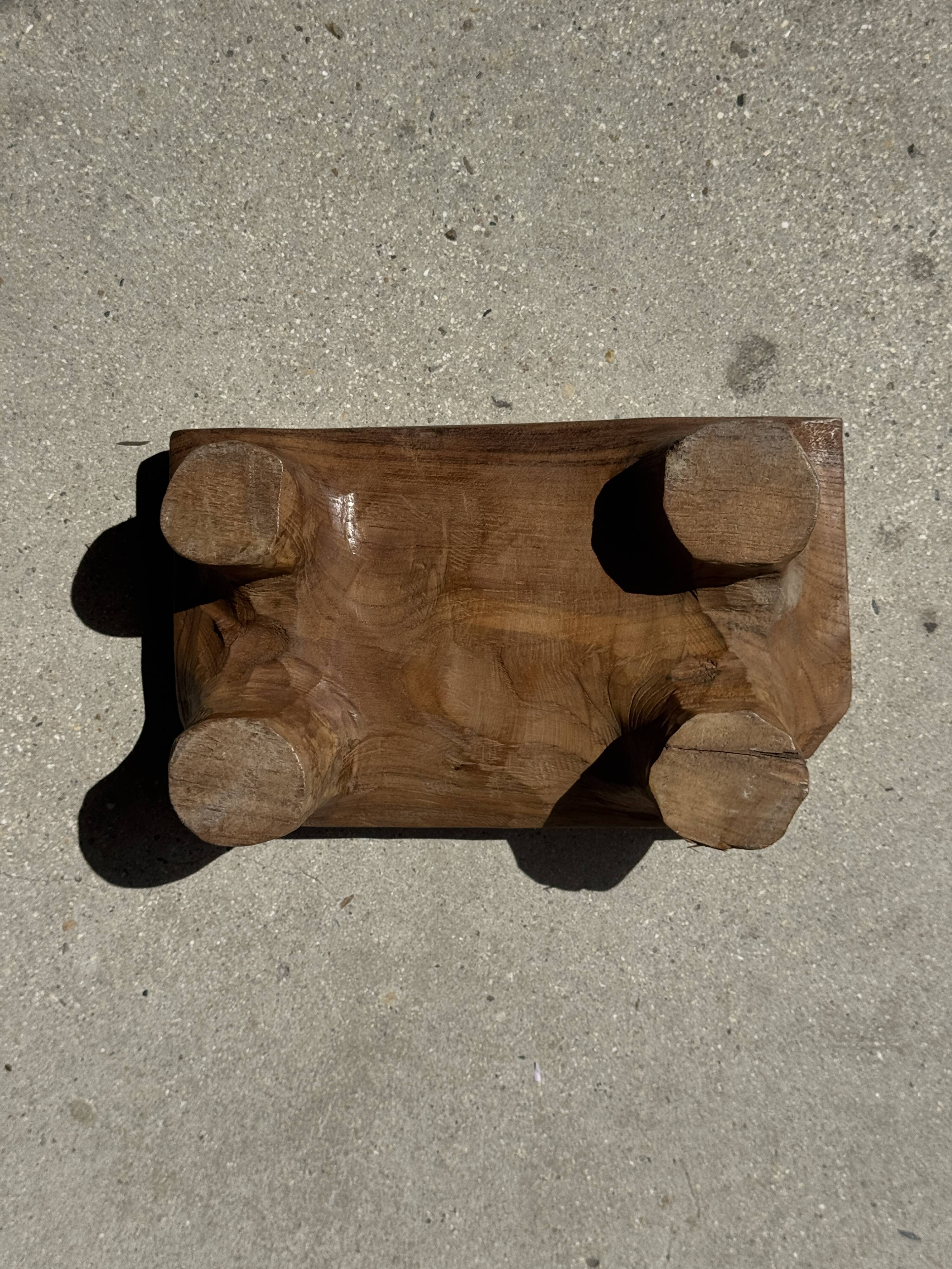 Small stool, teak footrest with short cut corners.
