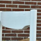 Vintage chair with wicker seat, minimalist design