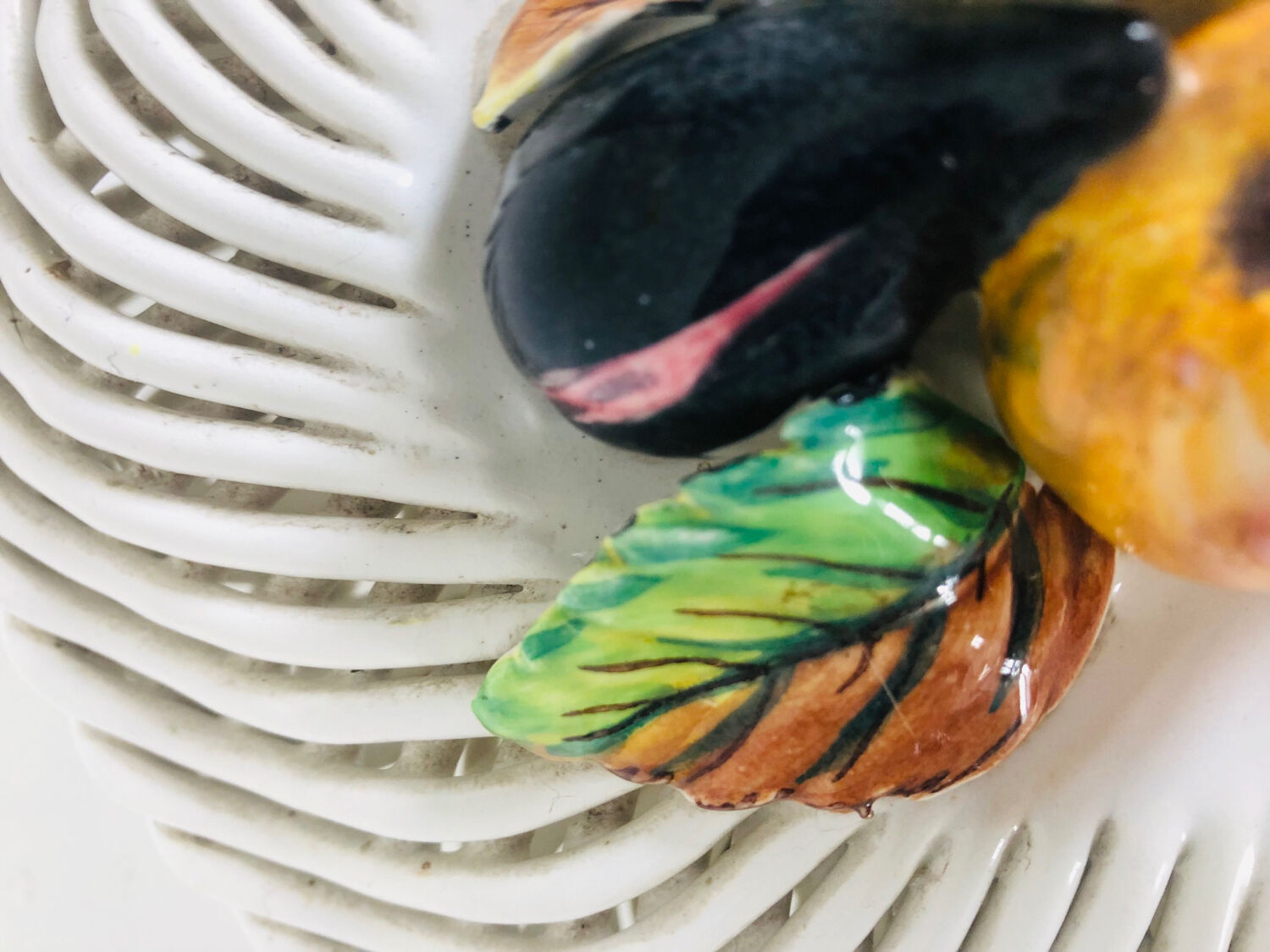 Covered basket in woven ceramic and fruit slip.