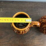 Set of 2 vintage caramel-colored slip mugs with flower pattern