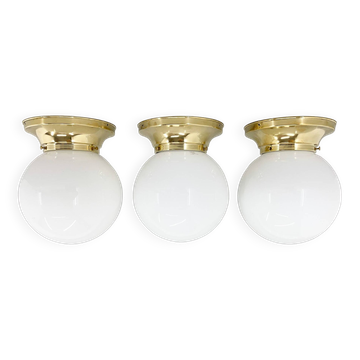 Set of three mid-century brass and milk glass ceiling ligts, restored