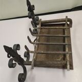pair of chenets with iron grid and drawer