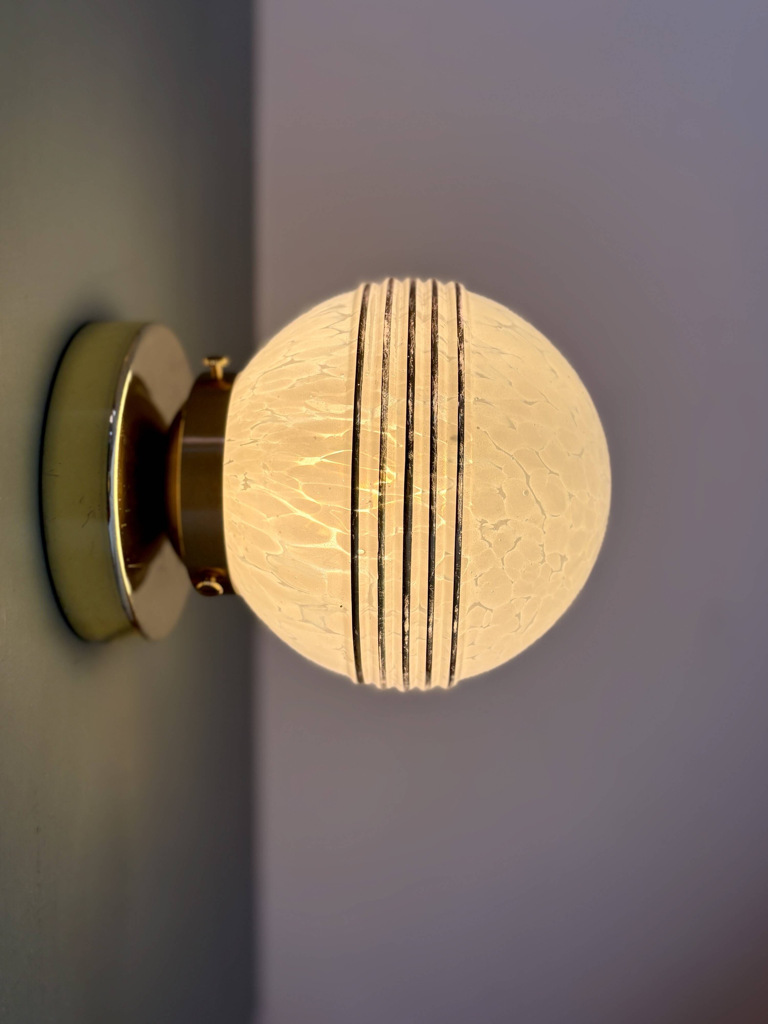 Vintage glass globe wall or ceiling light in white and gold from Clichy.
