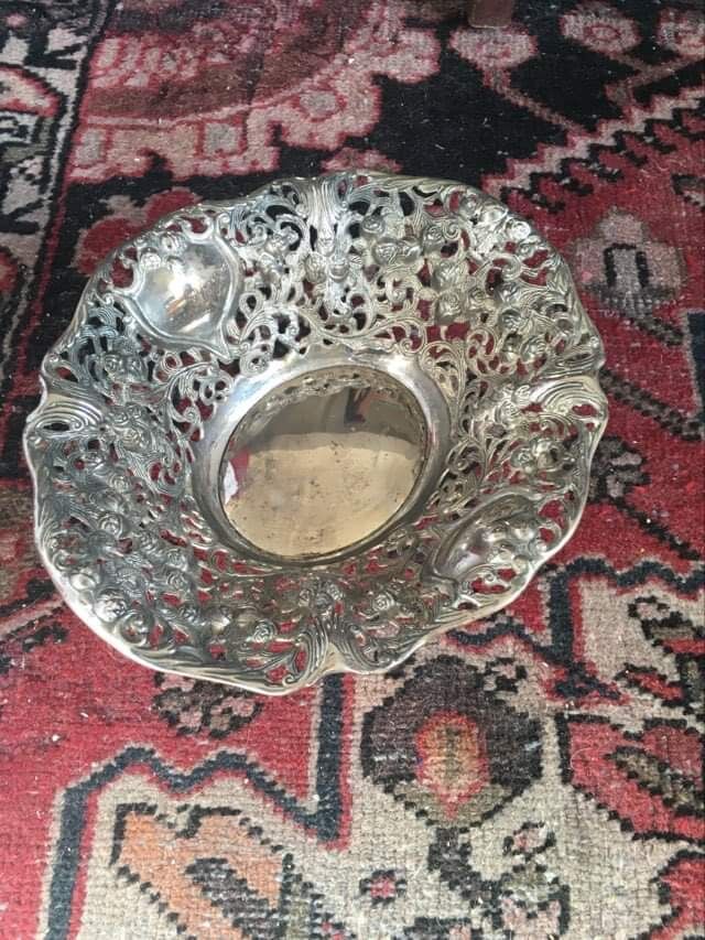 Silver metal basket with floral decoration