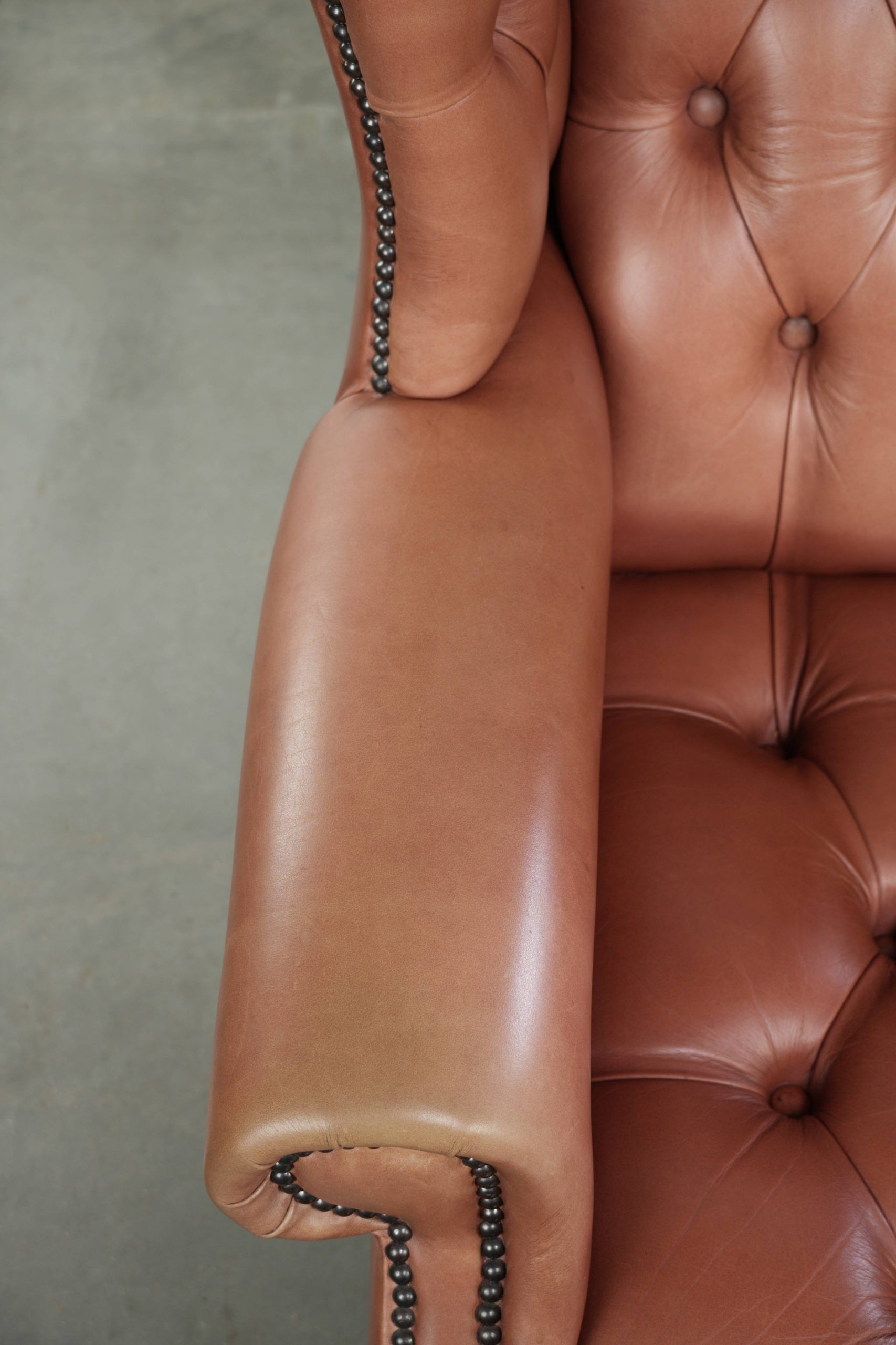 Classic English cowhide button seat chesterfield wingback armchair