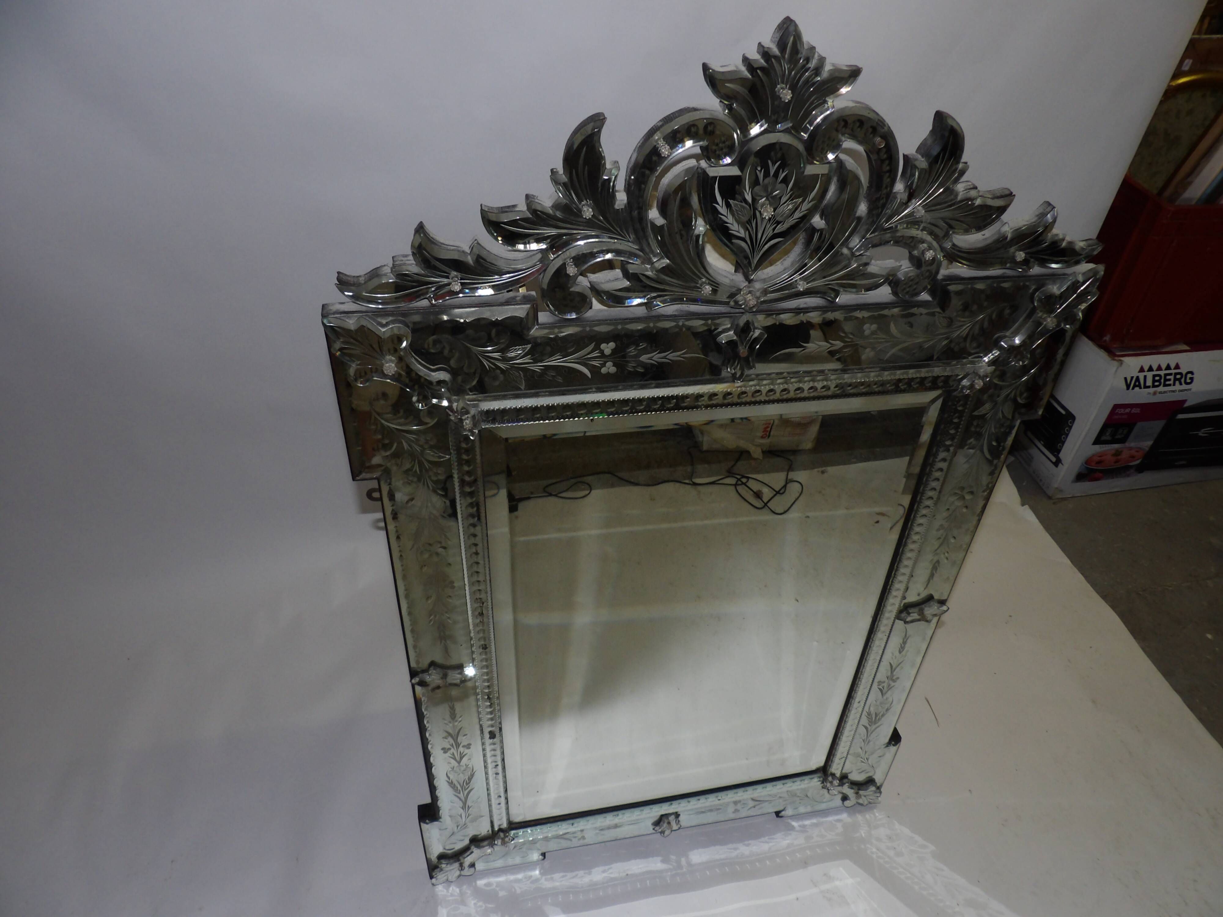 Richly decorated Venetian mirror