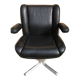 Vintage swivel black leather armchair