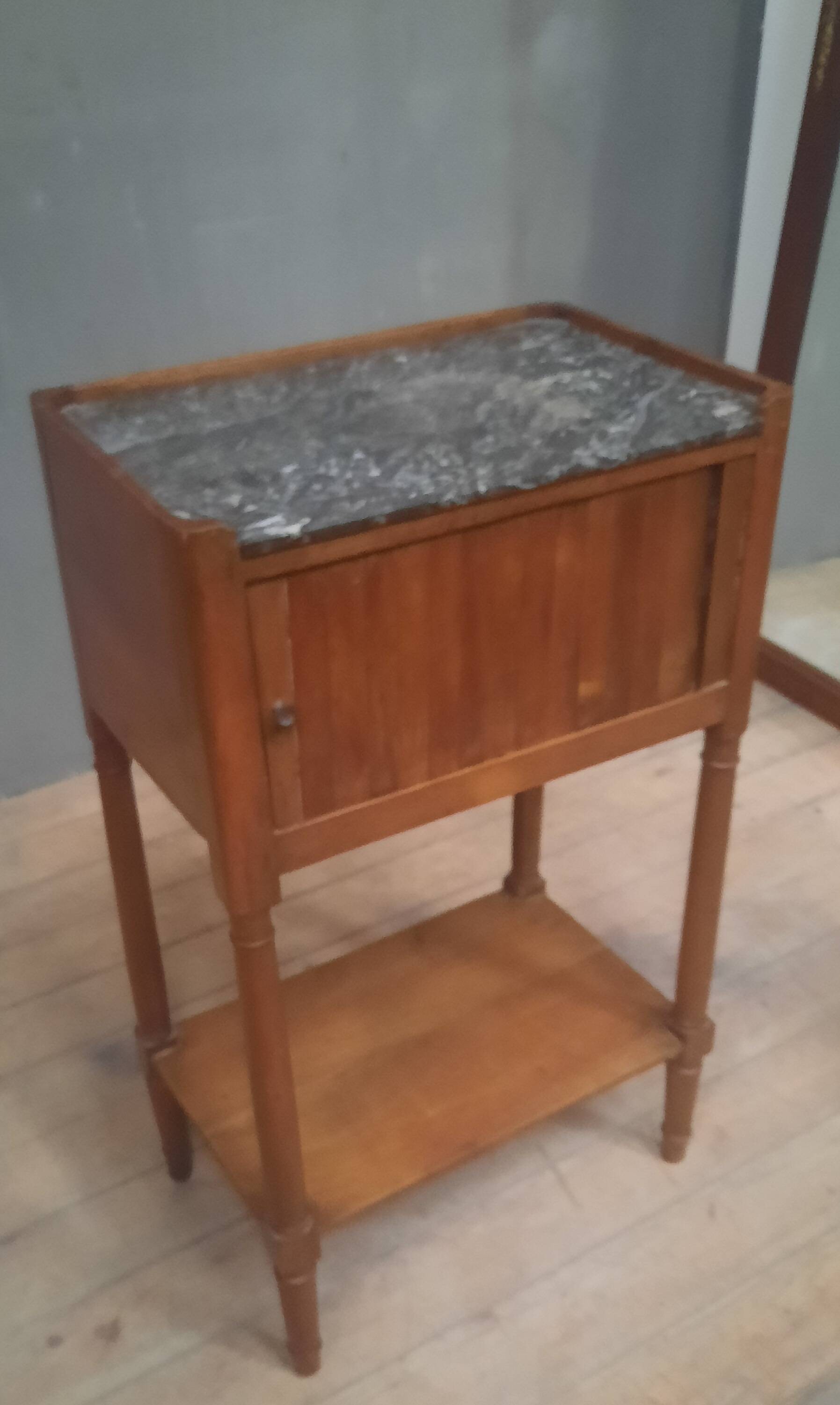 Curtained bedside table from the nineteenth century.