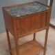 Curtained bedside table from the nineteenth century.