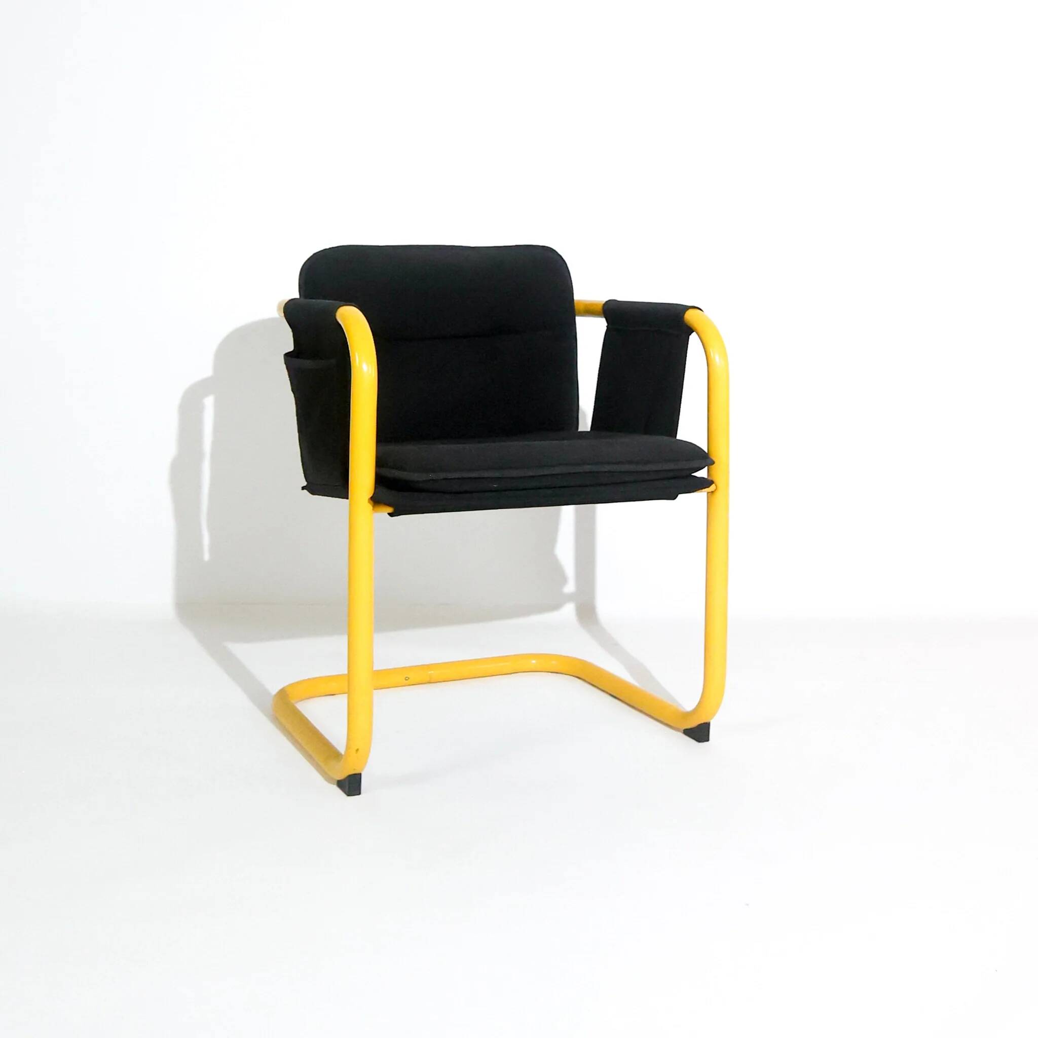 Postmodern cantilever armchair with a yellow tubular frame, Italy, 1970s.