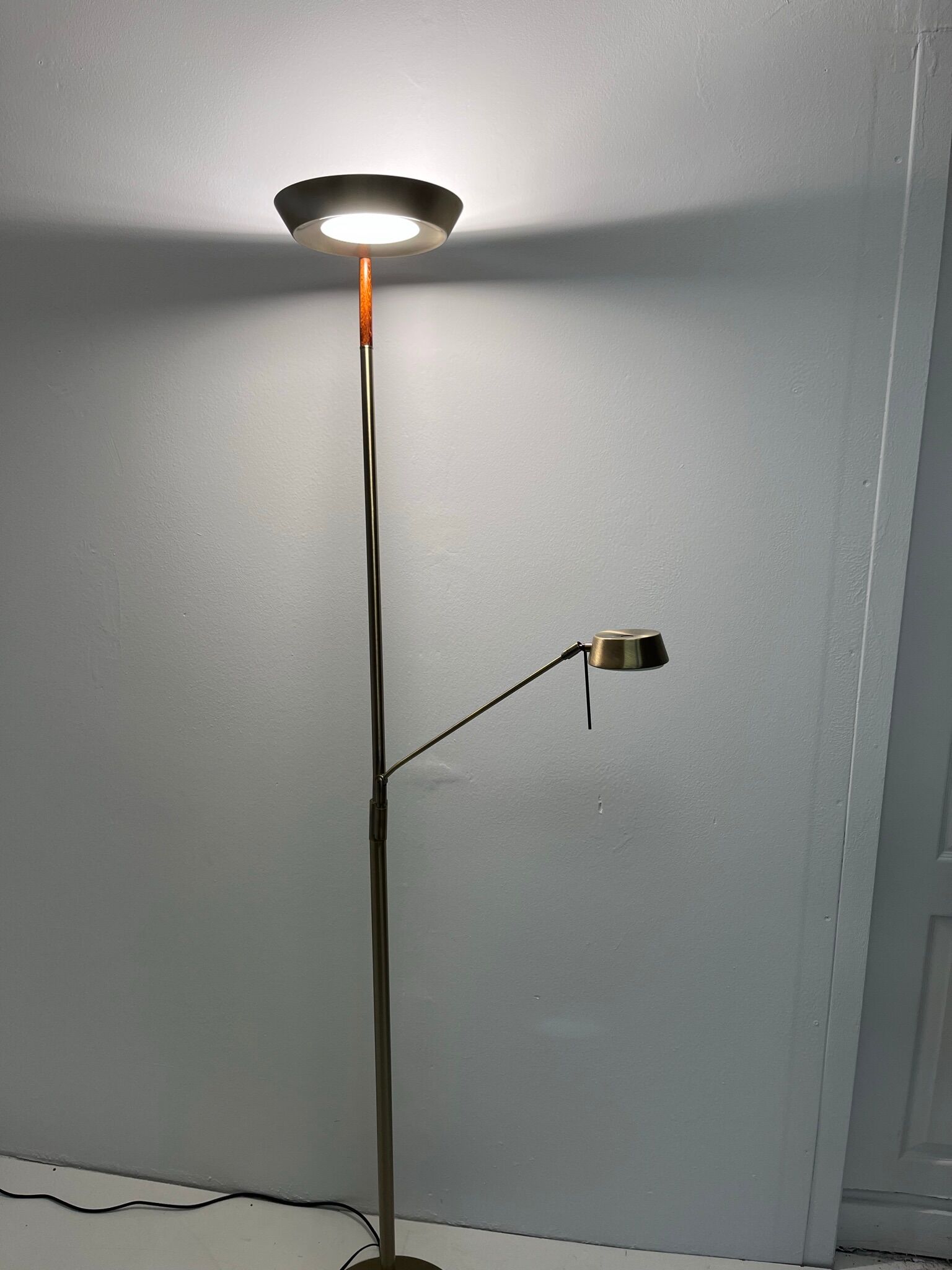 Golden metal floor lamp with reading light