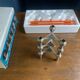 Set of 3 S22 candle holders and 9 vintage 1970 NAGEL modular candles in box.