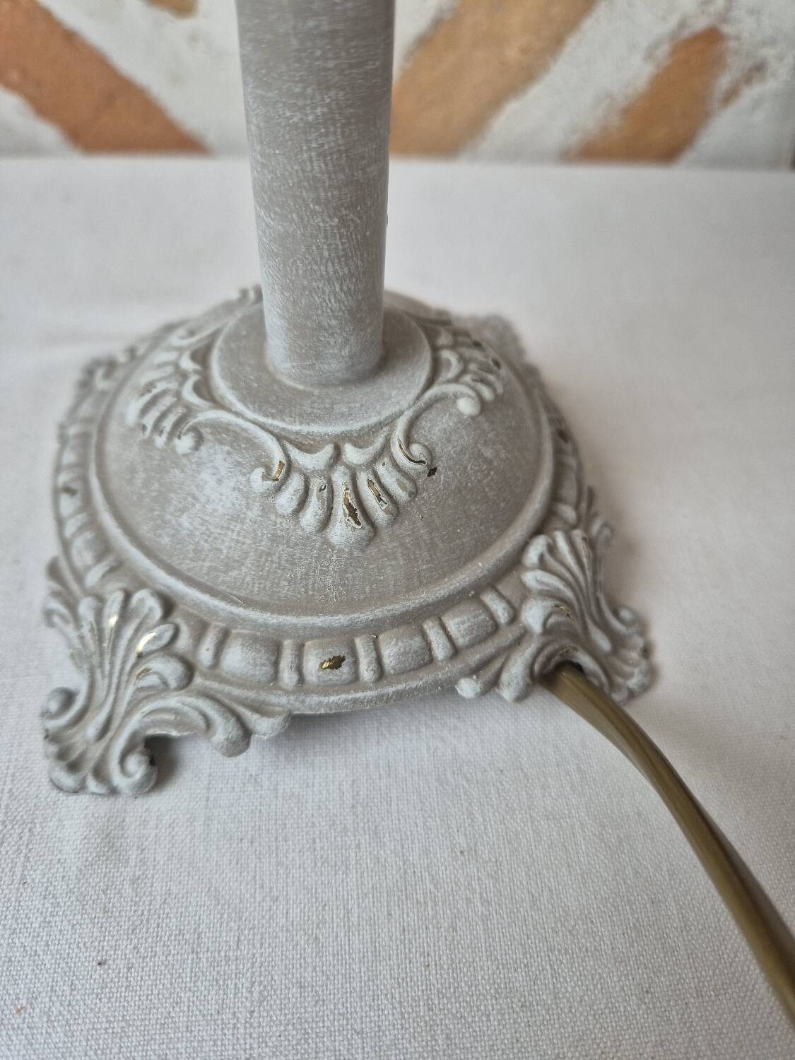 Patinated taupe bedside lamp