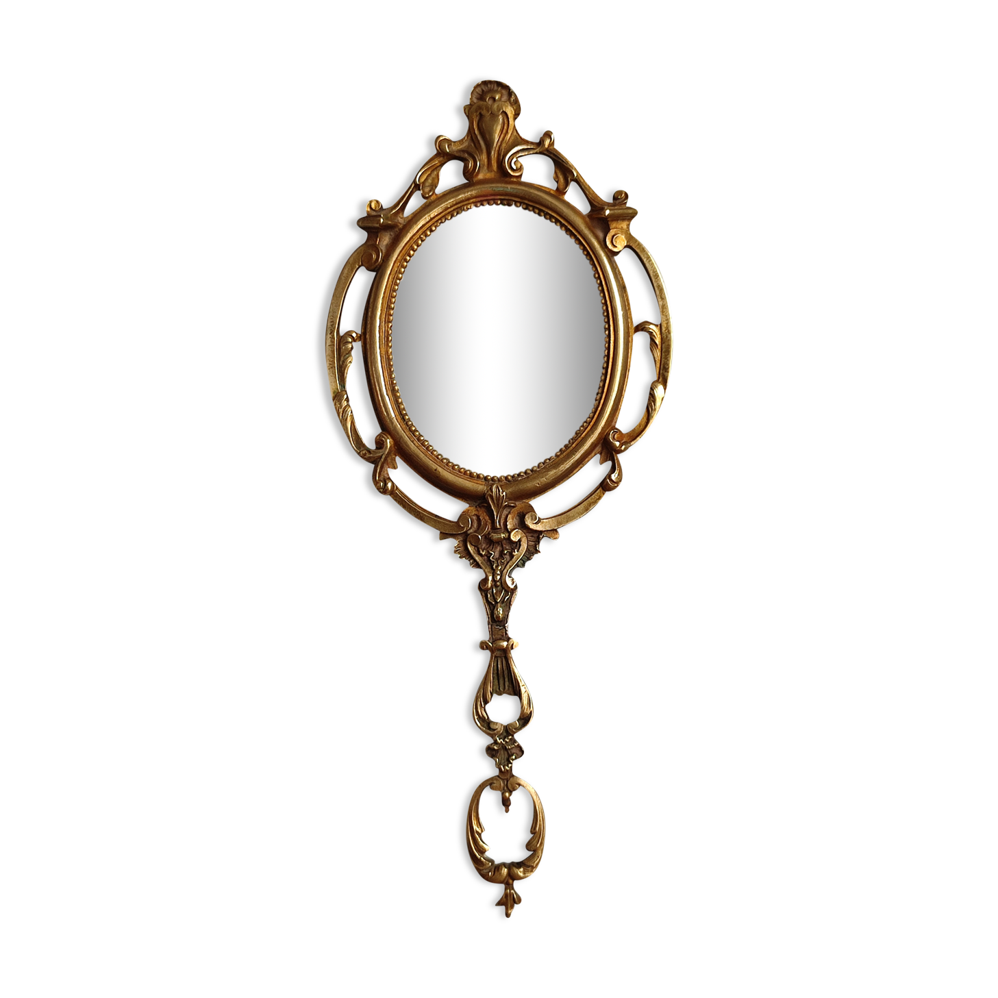 Antique hand-facing mirror in bronze and beveled glass