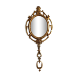 Antique hand-facing mirror in bronze and beveled glass