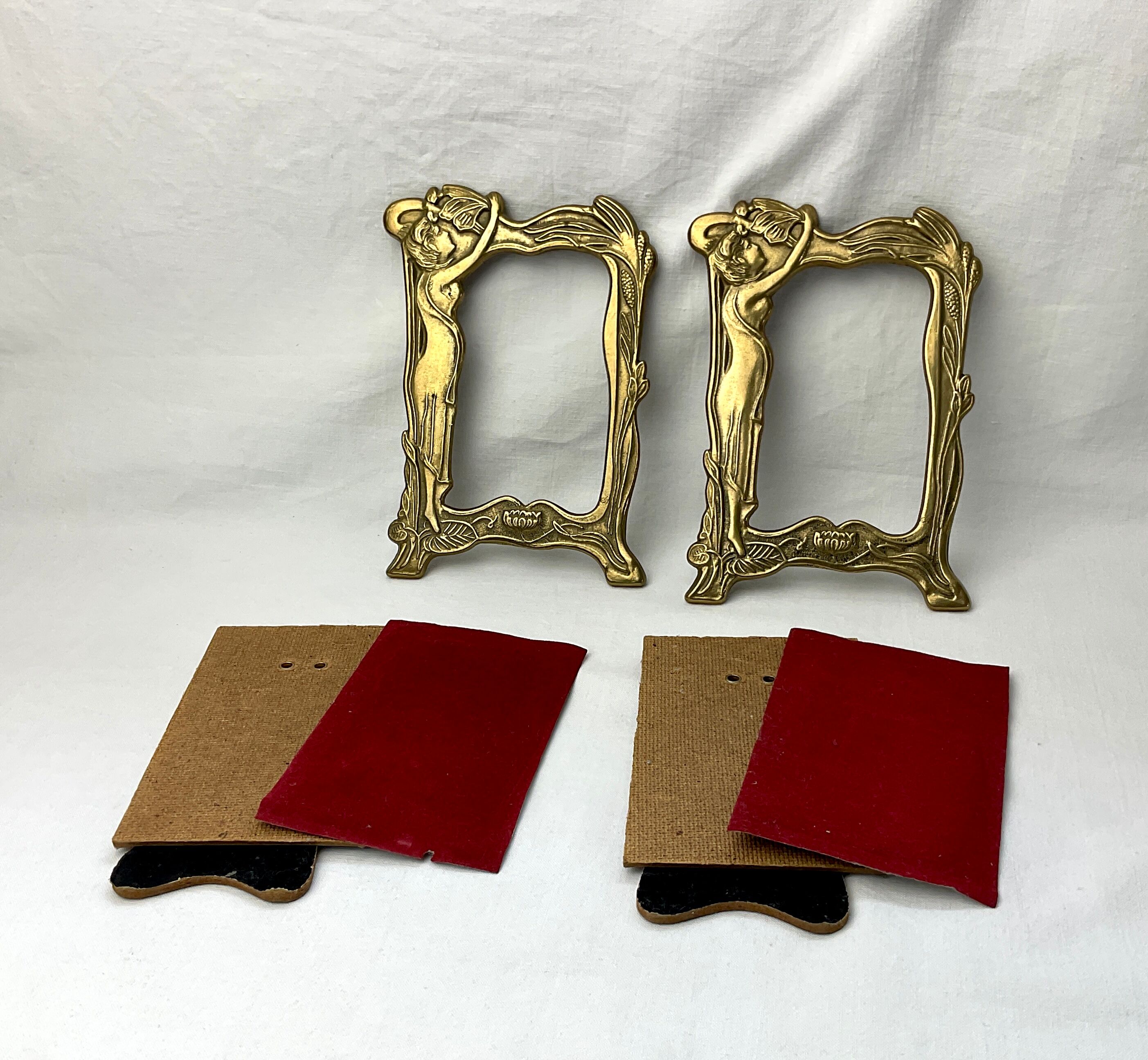 Pair of brass frames with Art Nouveau style woman