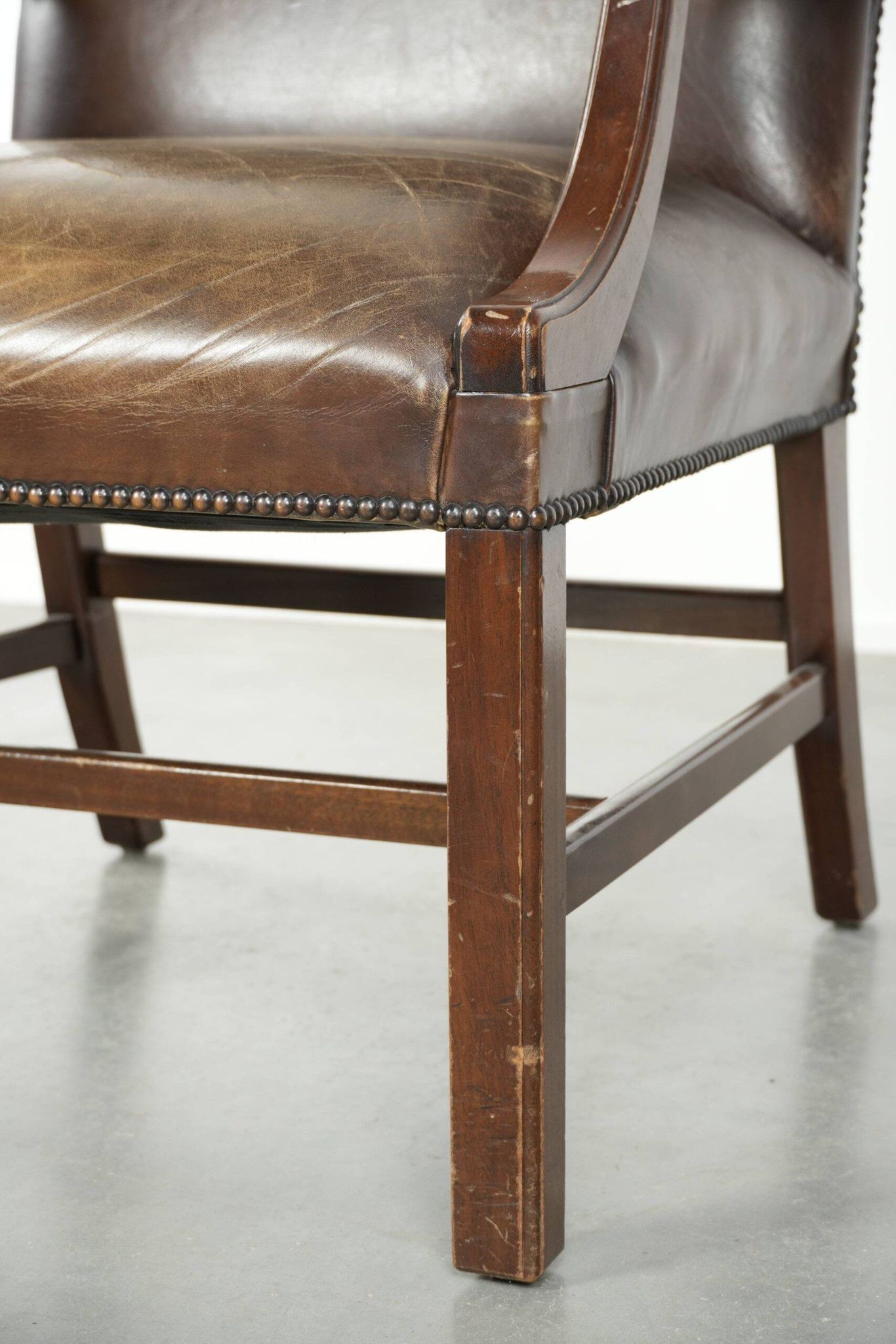 Wooden cow leather English Gainsborough chair with a stunning appearance
