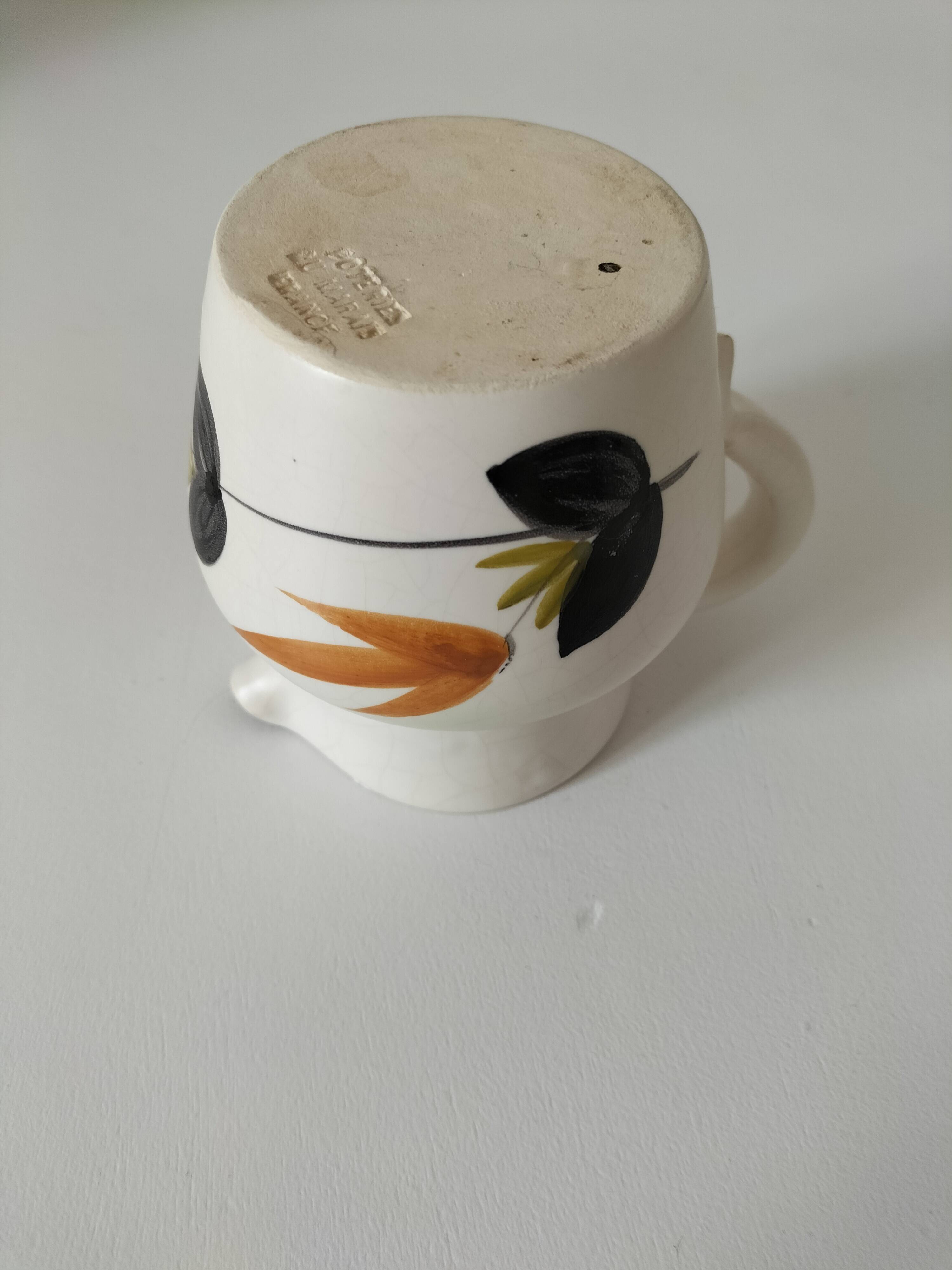 Vintage Marais pottery pitcher with orange floral decoration