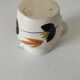 Vintage Marais pottery pitcher with orange floral decoration