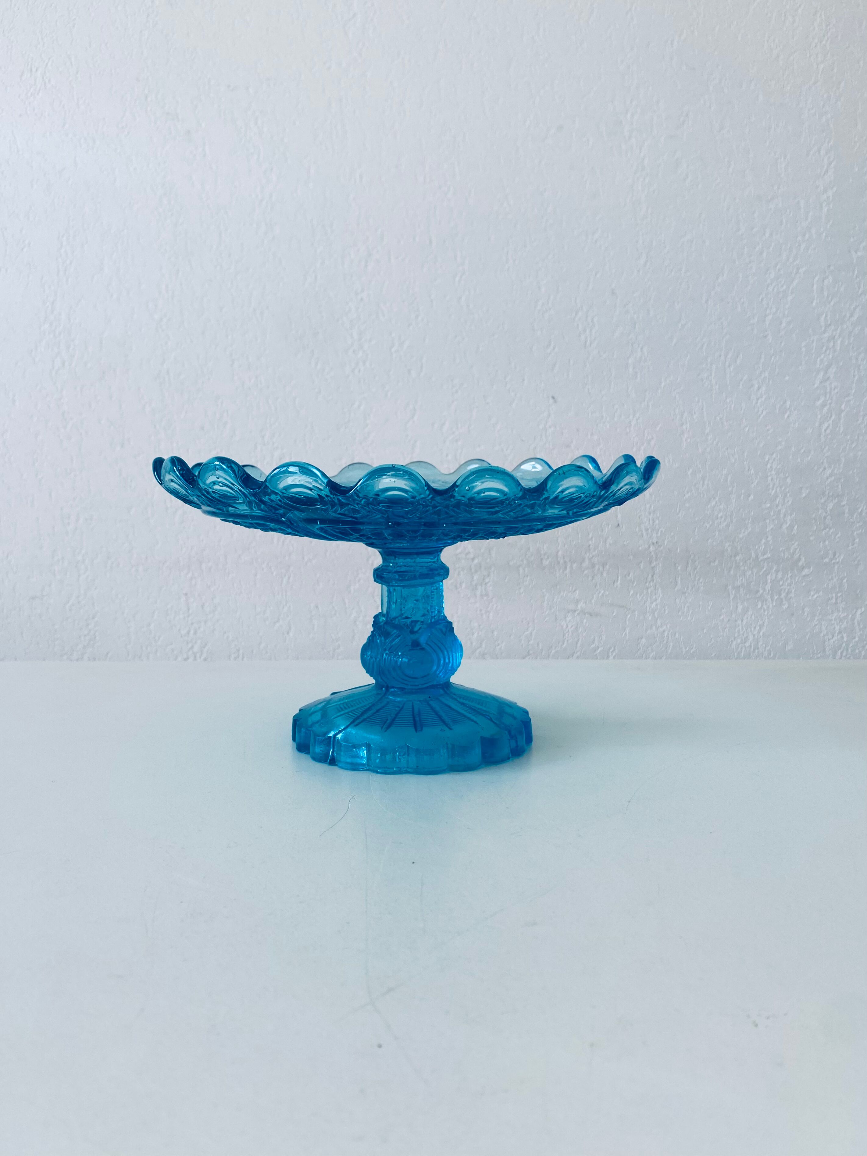 Blue glass stand cup