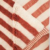 A handmade Moroccan striped terracotta rug, 150/250cm