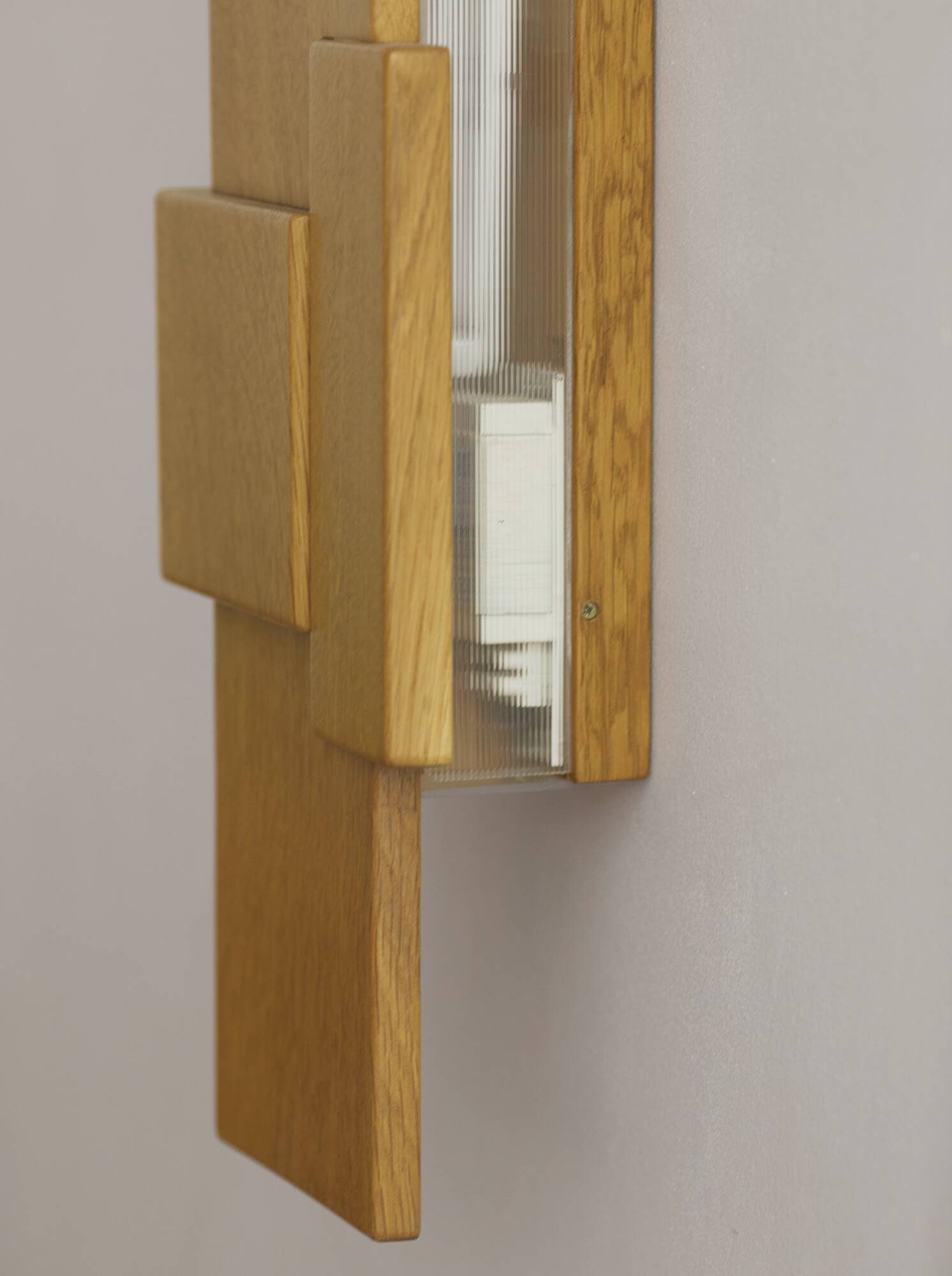 Pair of handcrafted modernist solid oak wall lights, circa 1980