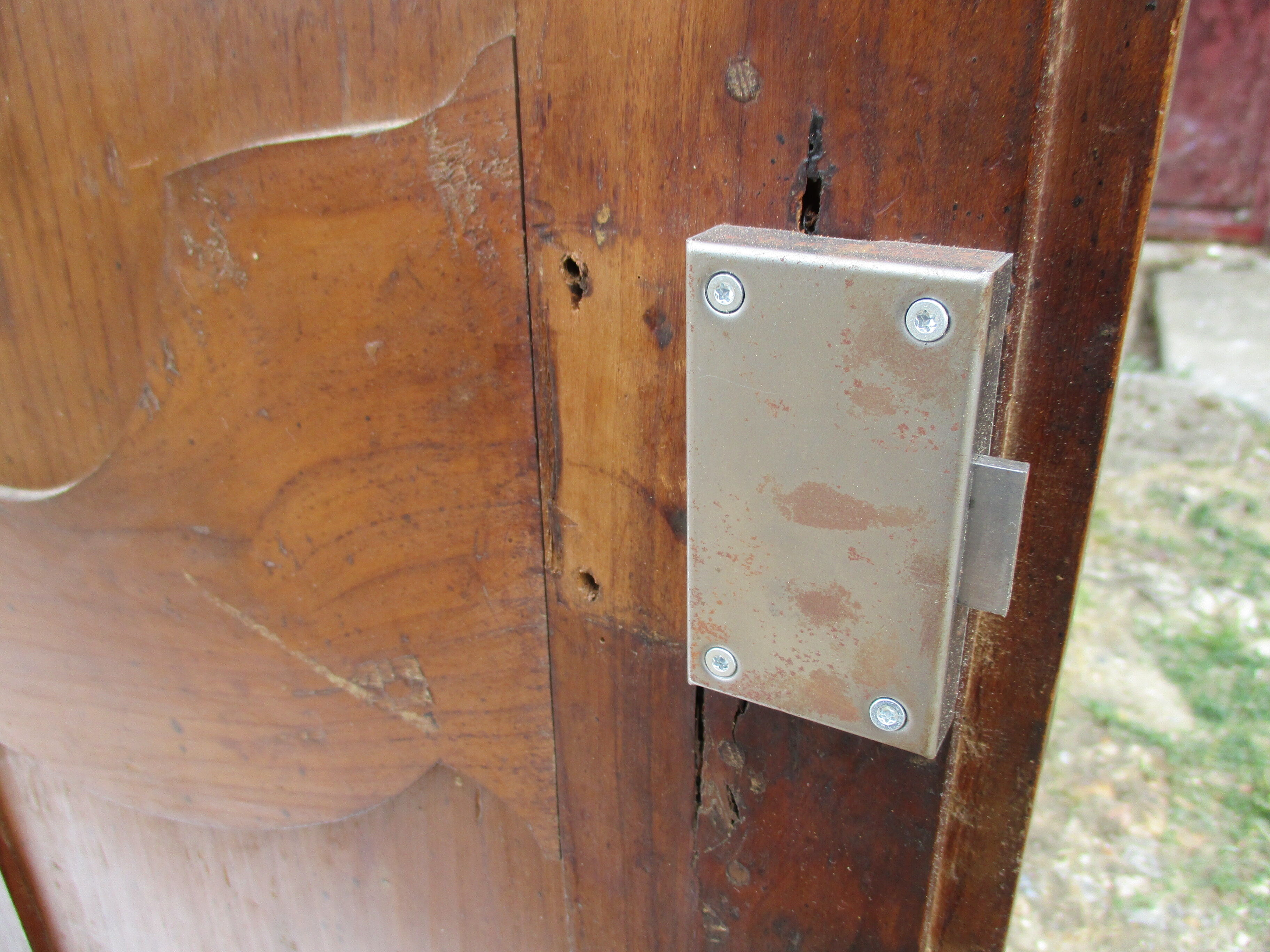 Small solid wooden cabinet with a gendarme hat
