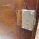 Small solid wooden cabinet with a gendarme hat