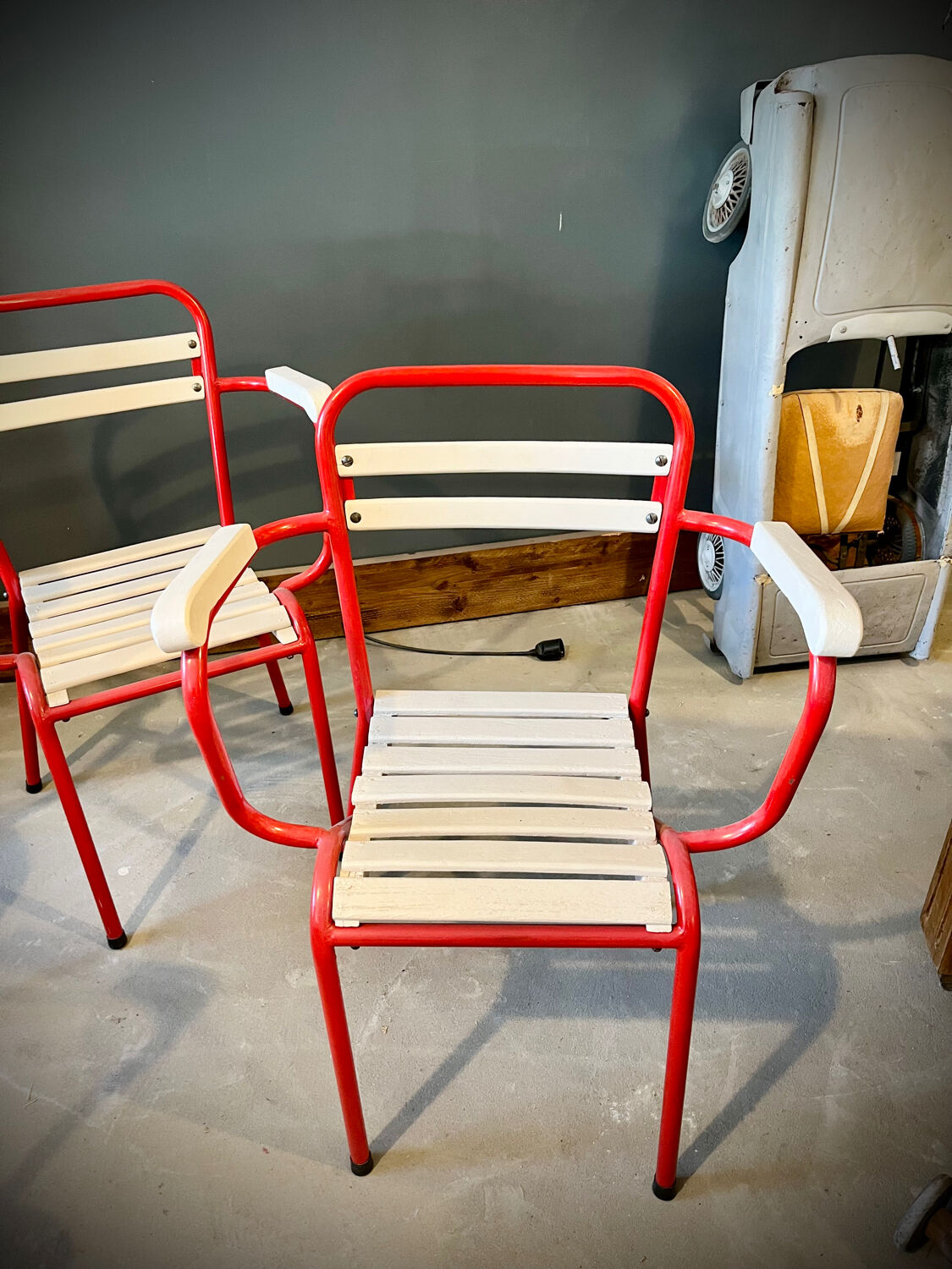 Four TOLIX chairs with armrests