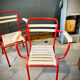 Four TOLIX chairs with armrests