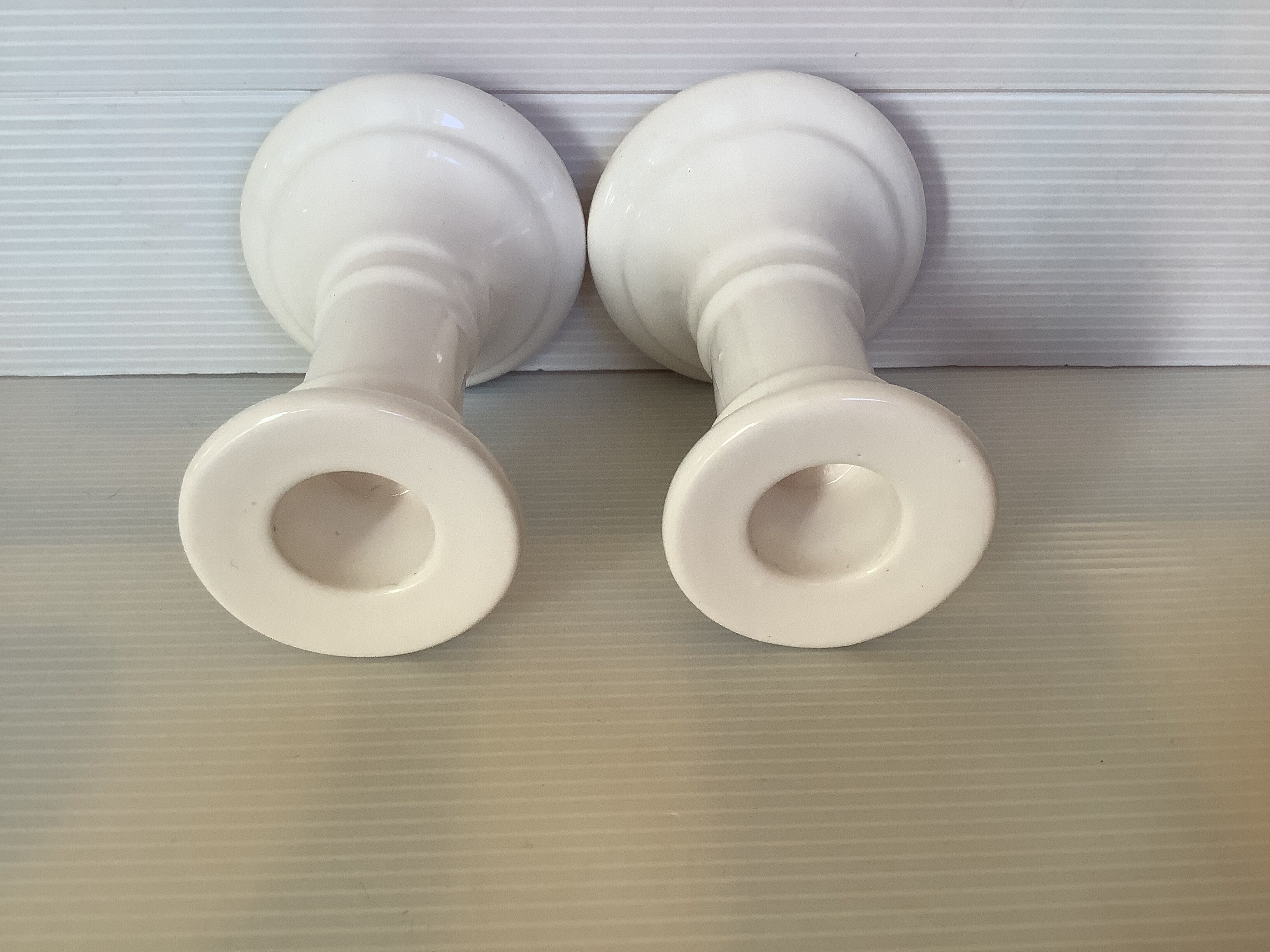 Pair of white earthenware candle holders