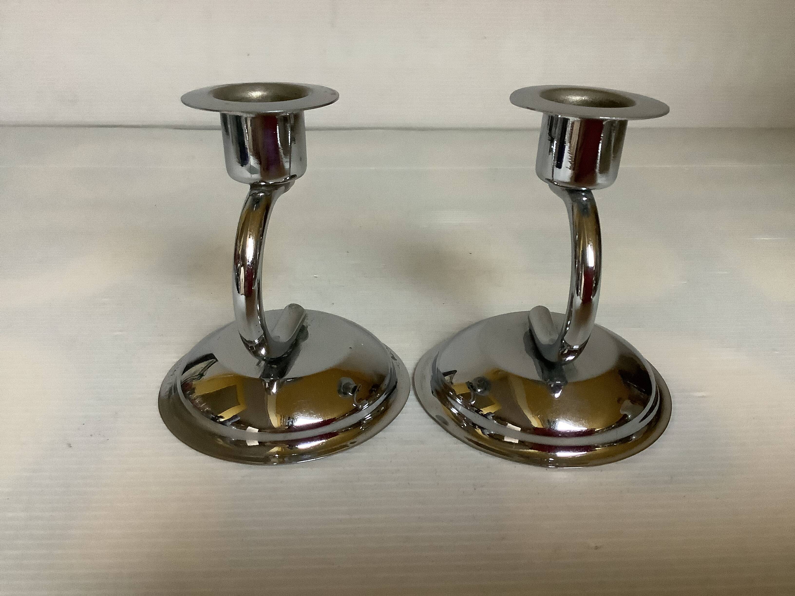 Pair of small silver metal candlesticks