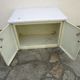 Old storage furniture in sheet metal and enamelled sheet metal