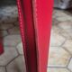 Red leather chairs by Arper