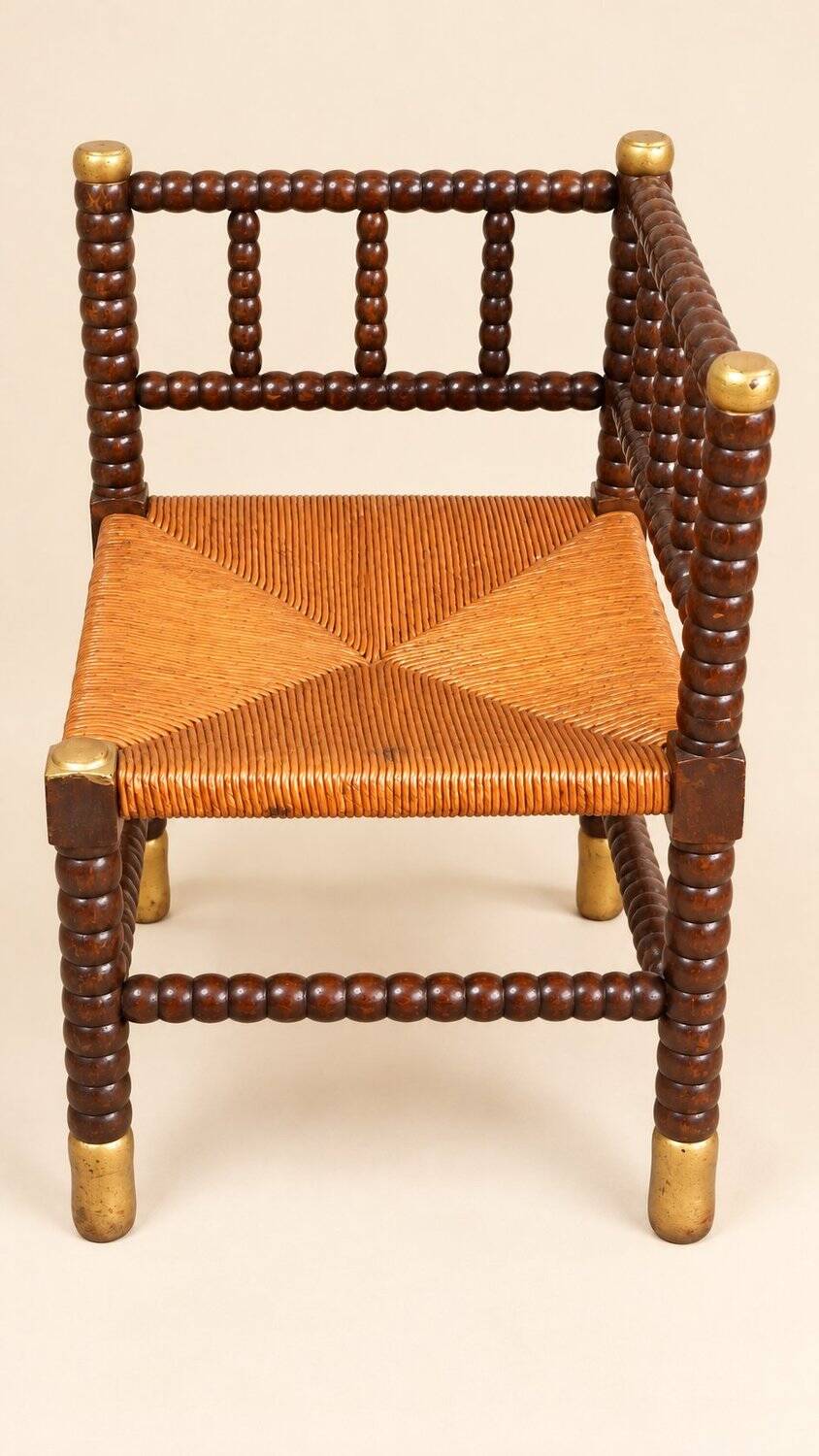 Fireplace corner chair in Louis XIII style, turned wood with braided rush, 19th century.