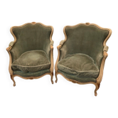 Paire de bergères de style Louis XV en bois laqué et doré XX siècle
